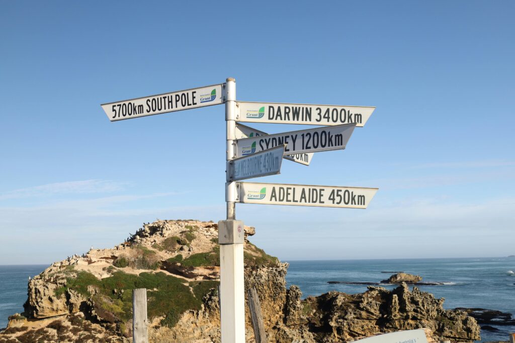 Signpost near Port Macdonnell with directions to major Australian cities and landmarks.